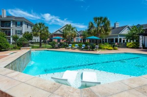 Apartments in Conroe, Texas - Pool & Tanning Shelf with Community View         