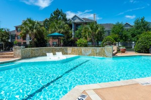 Apartments in Conroe, Texas - Pool with Tanning Shelf         