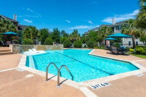 Apartments in Conroe, Texas  -Pool with Tanning Shelf & Patio Area         