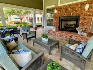 Apartments for rent in Conroe, TX - Outdoor Cabana with Fireplace and Seating Area